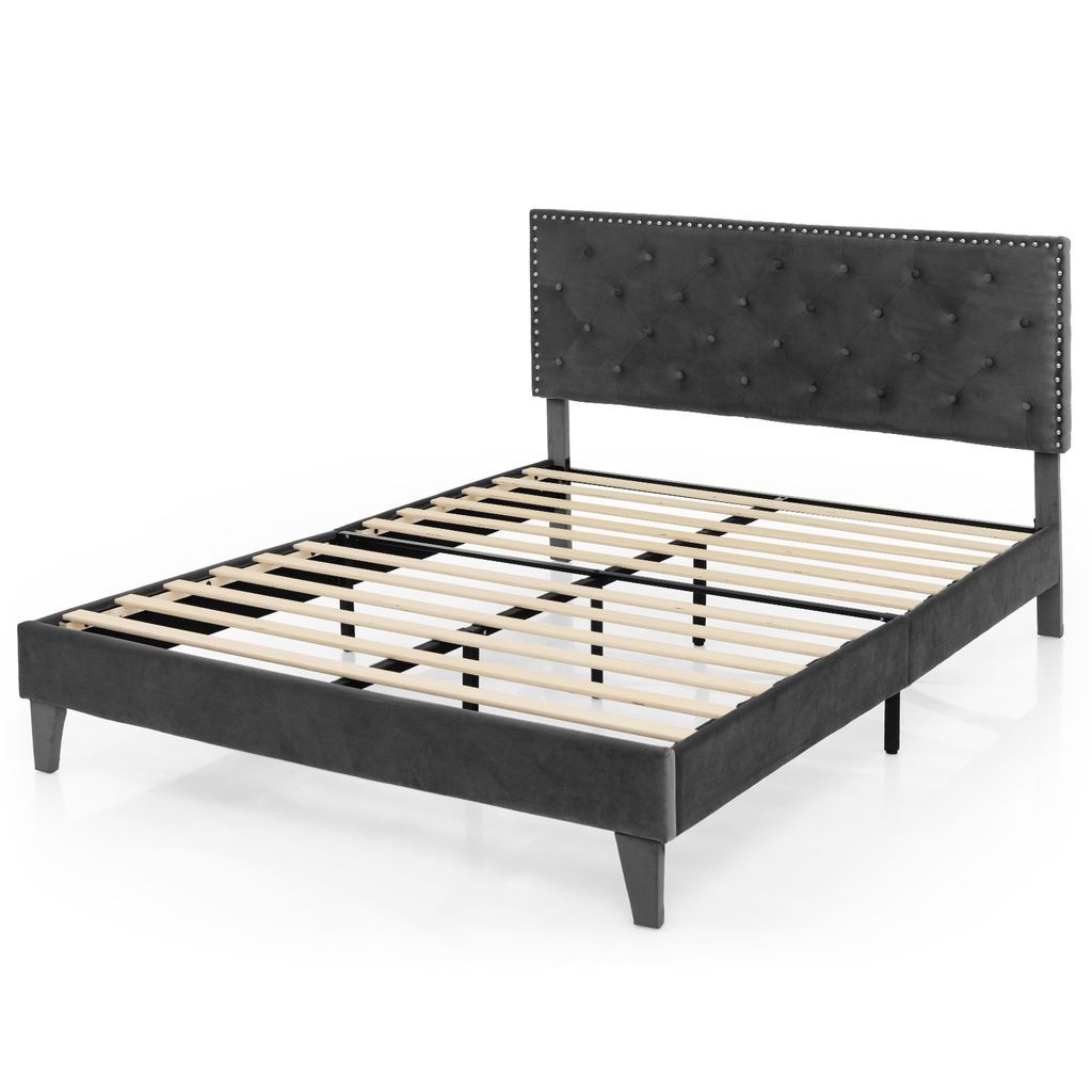 A dark gray upholstered bed frame with a tufted headboard and wooden slats for mattress support, shown against a white background.