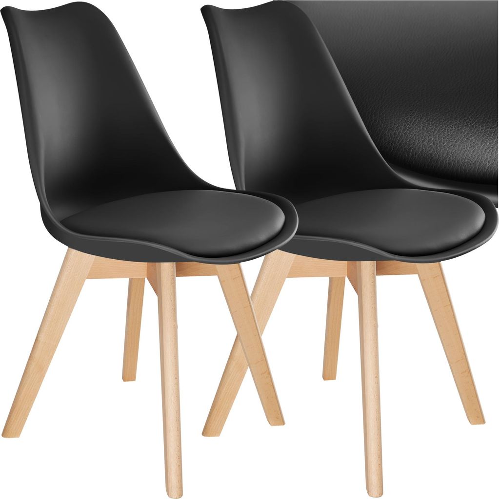 Two black dining chairs with wooden legs are shown against a white background.