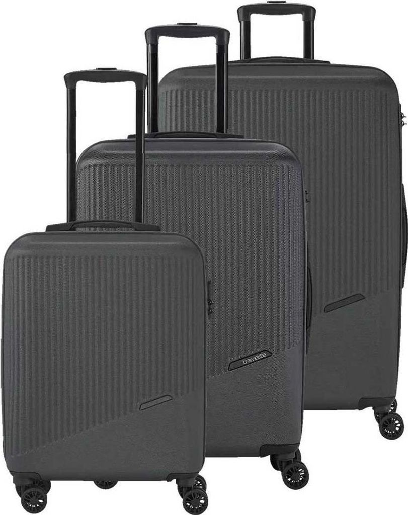 Three black suitcases of different sizes are arranged diagonally on a white background.