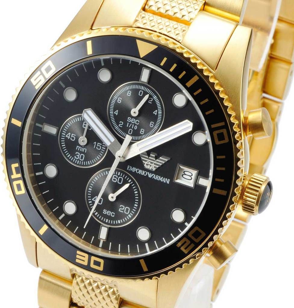 Close-up of a gold Emporio Armani chronograph watch with a black dial.