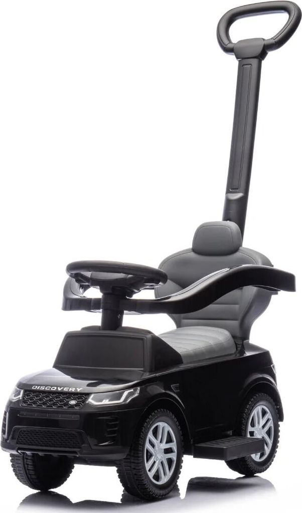 A black ride-on toy car, designed to look like a Land Rover Discovery, is shown against a white background. It features a push handle for adult guidance and a steering wheel for the child.