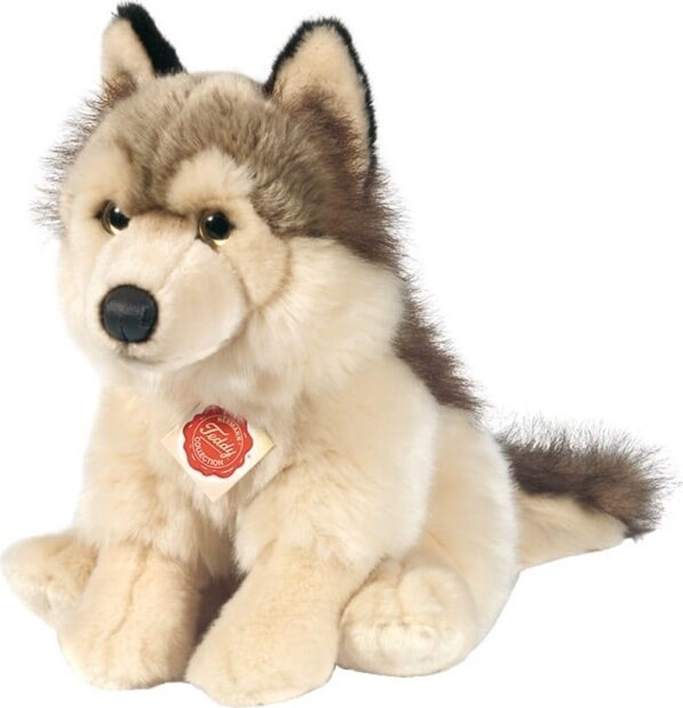 A plush toy wolf sitting on a white background.