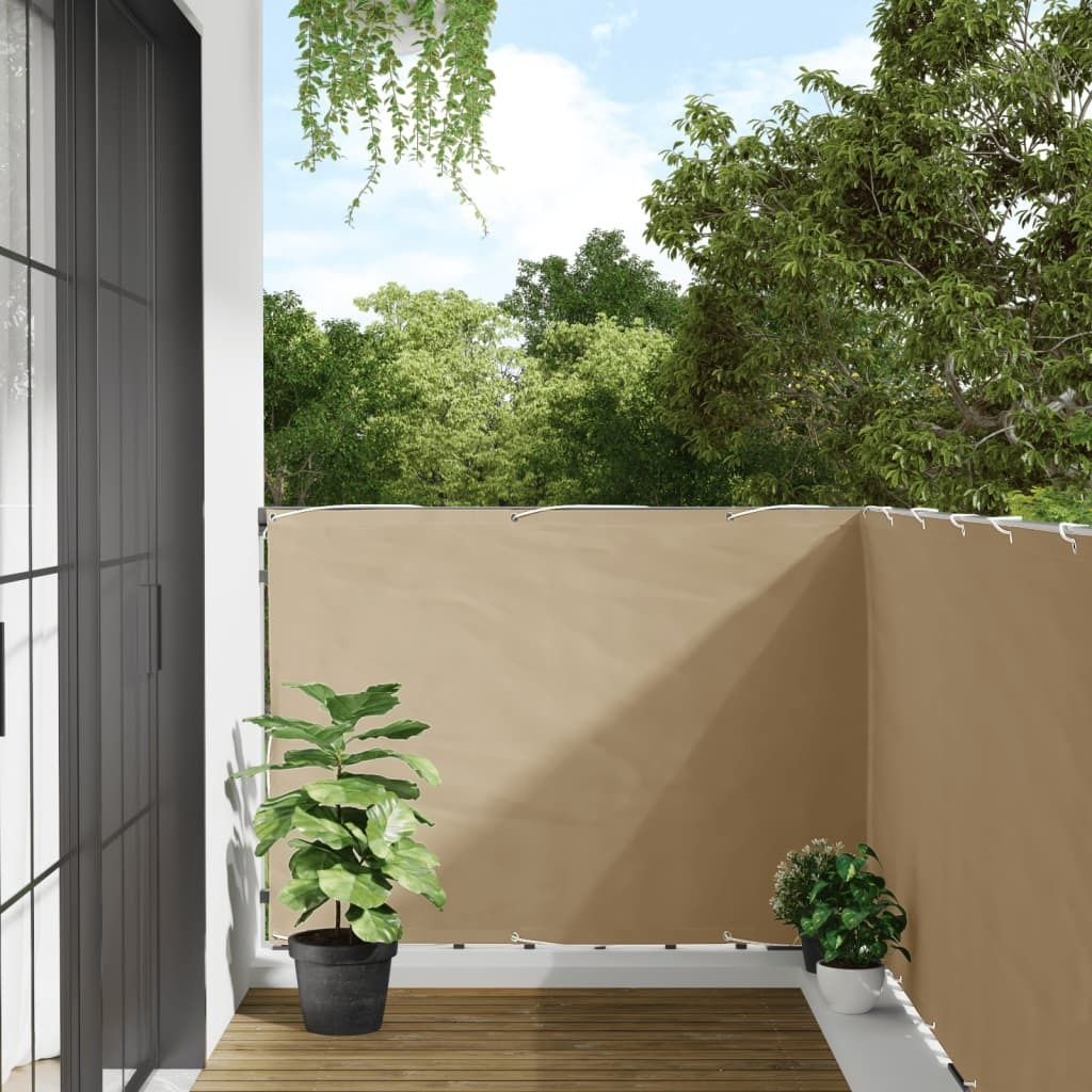 A balcony with a beige privacy screen, wooden floor, and potted plants.