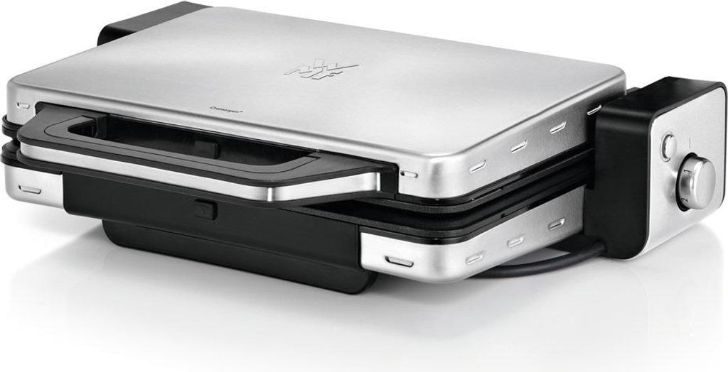 A silver and black electric fondue maker is shown on a white background.