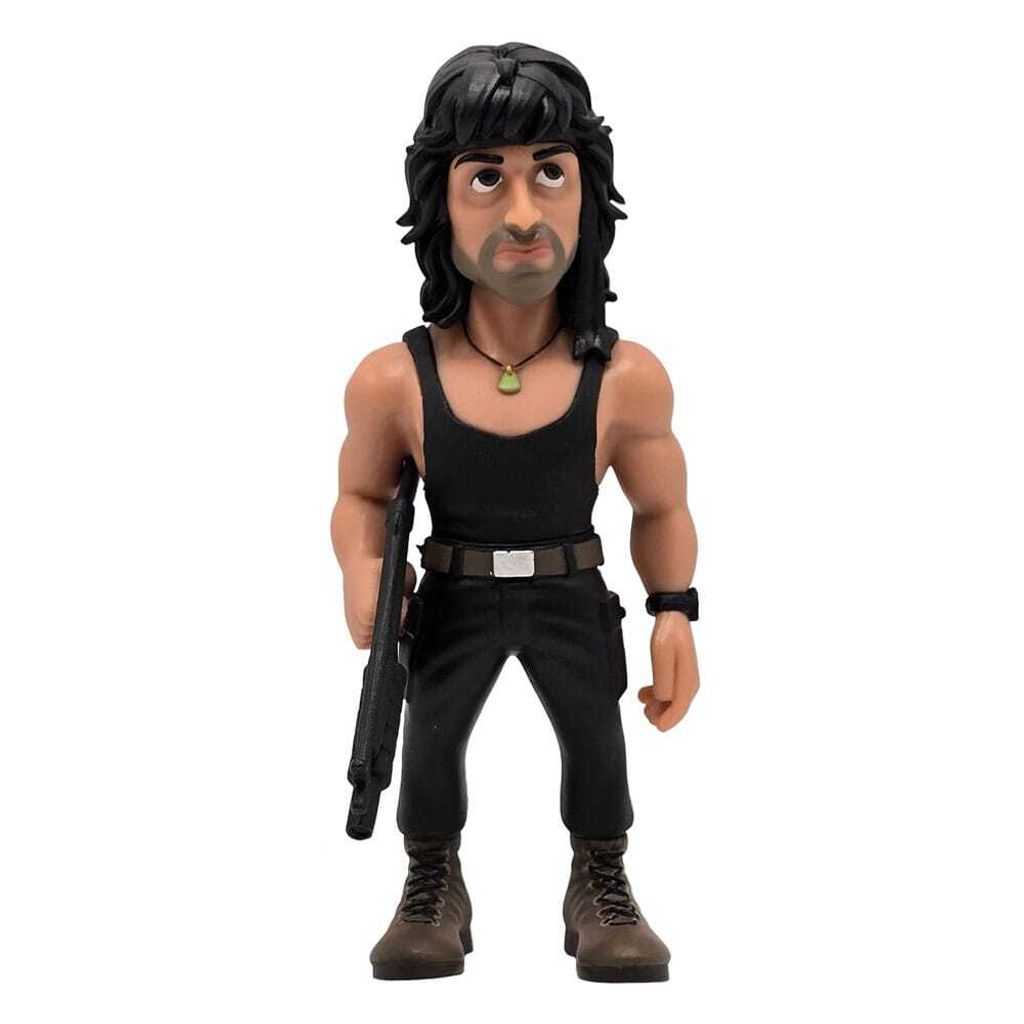 A figurine of John Rambo standing and holding a rifle.