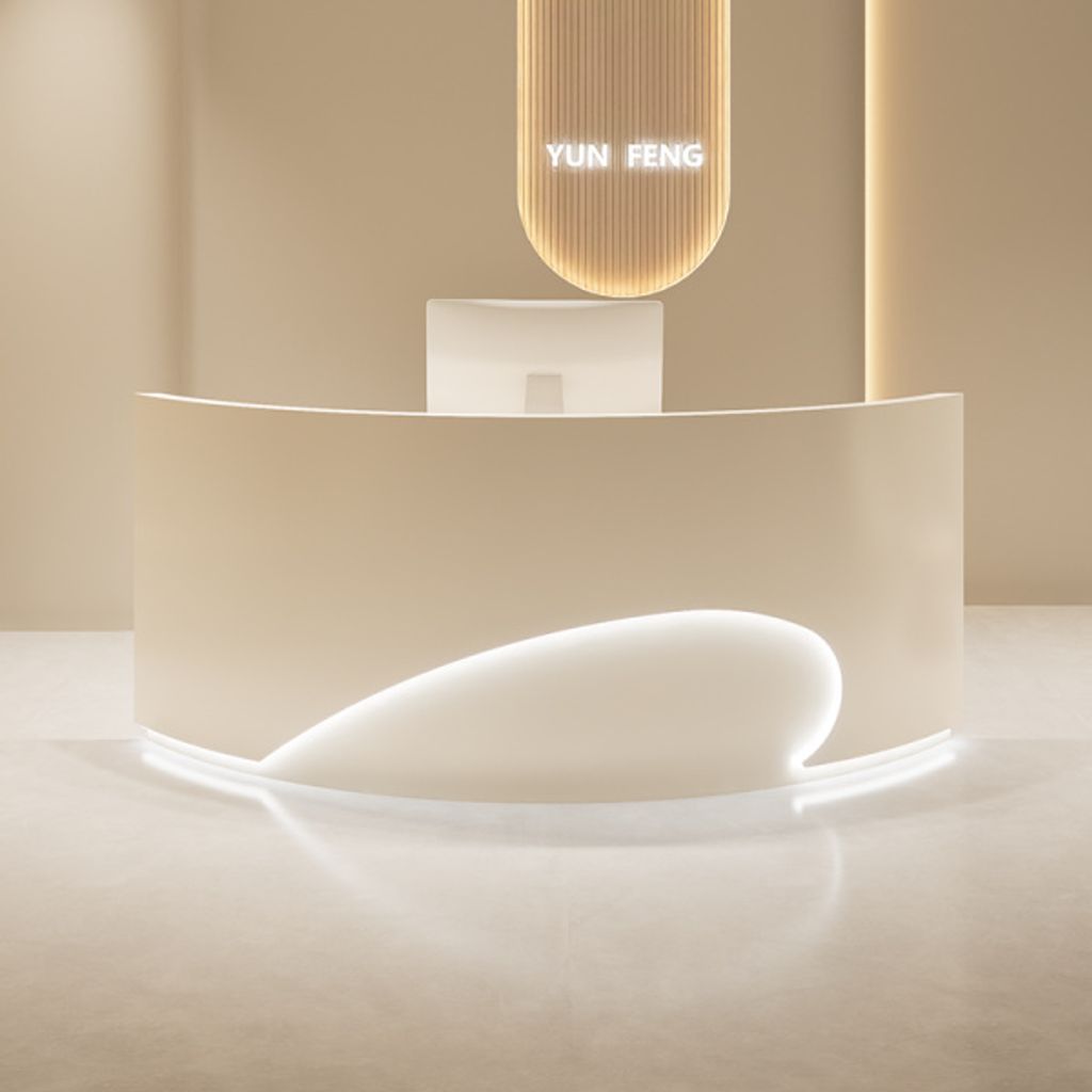 A modern reception desk in a clean, minimalist setting.