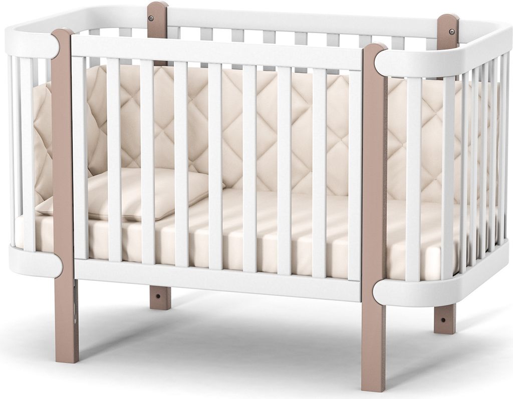 A baby crib with a mattress and padded sides, presented on a white background.