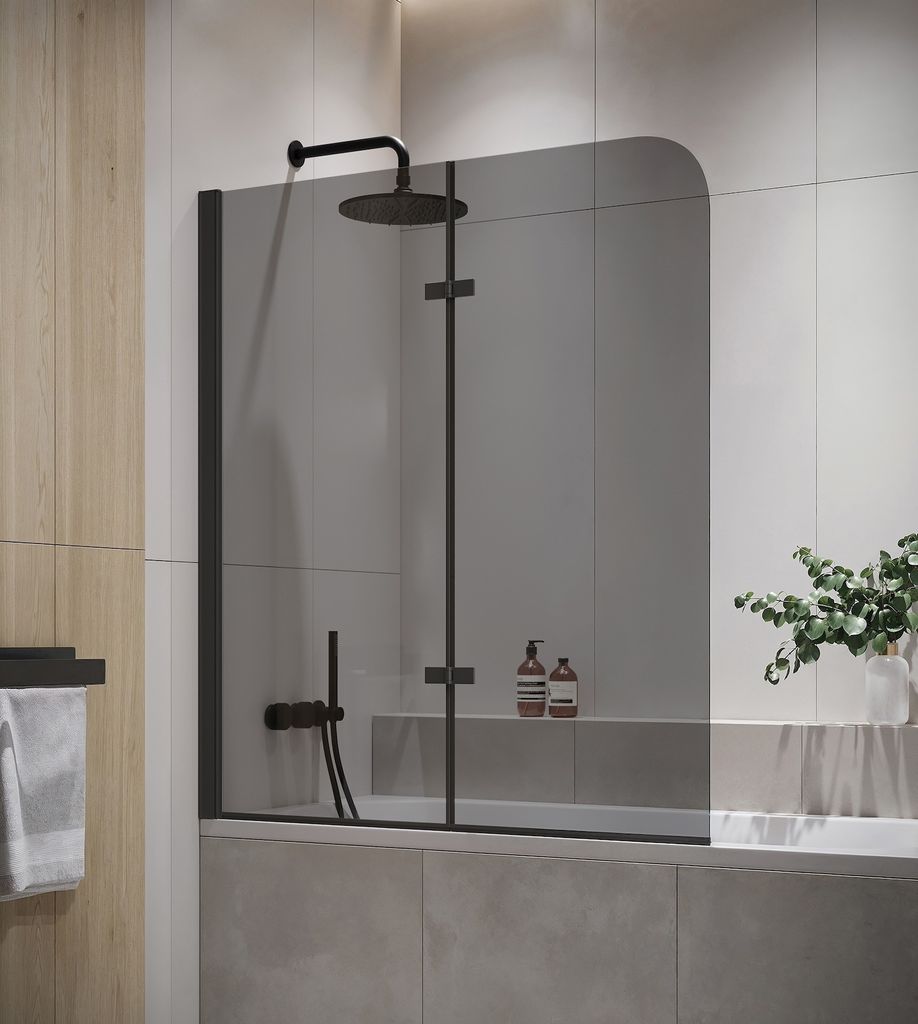 A modern bathroom with a bathtub and shower screen.