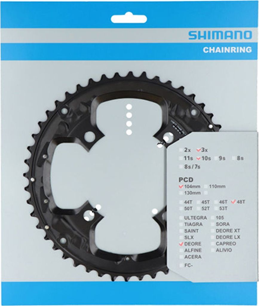 A Shimano chainring is displayed in its retail packaging.