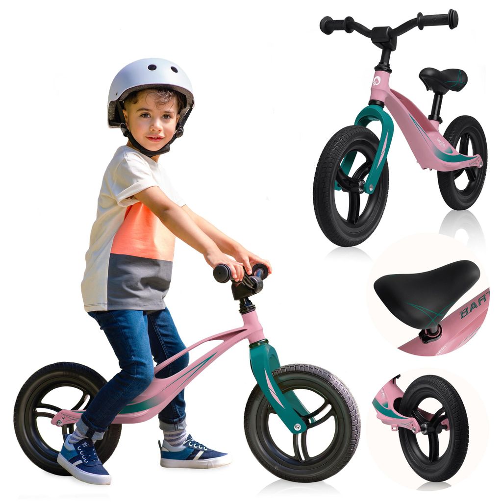 A young boy wearing a helmet rides a pink balance bike.