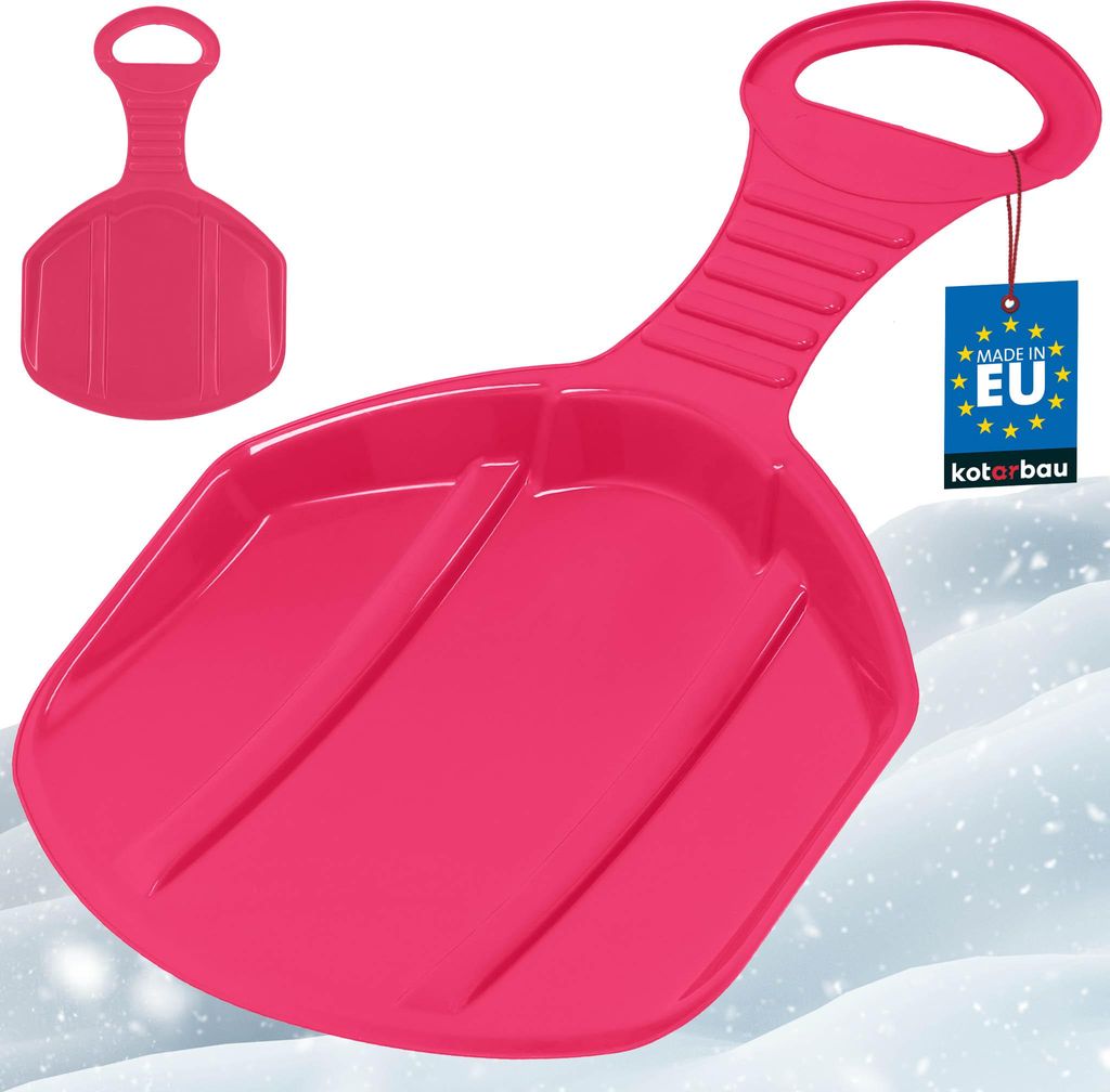 A pink plastic snow sled with a handle, shown on a snowy background.