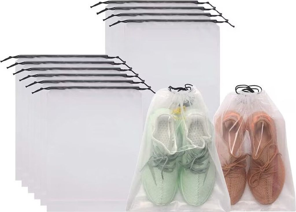 A pile of white mesh shoe bags, with two bags in the foreground containing shoes.
