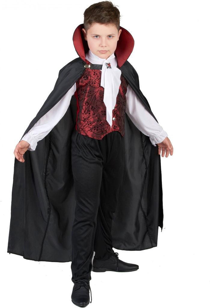 A young boy dressed in a vampire costume.