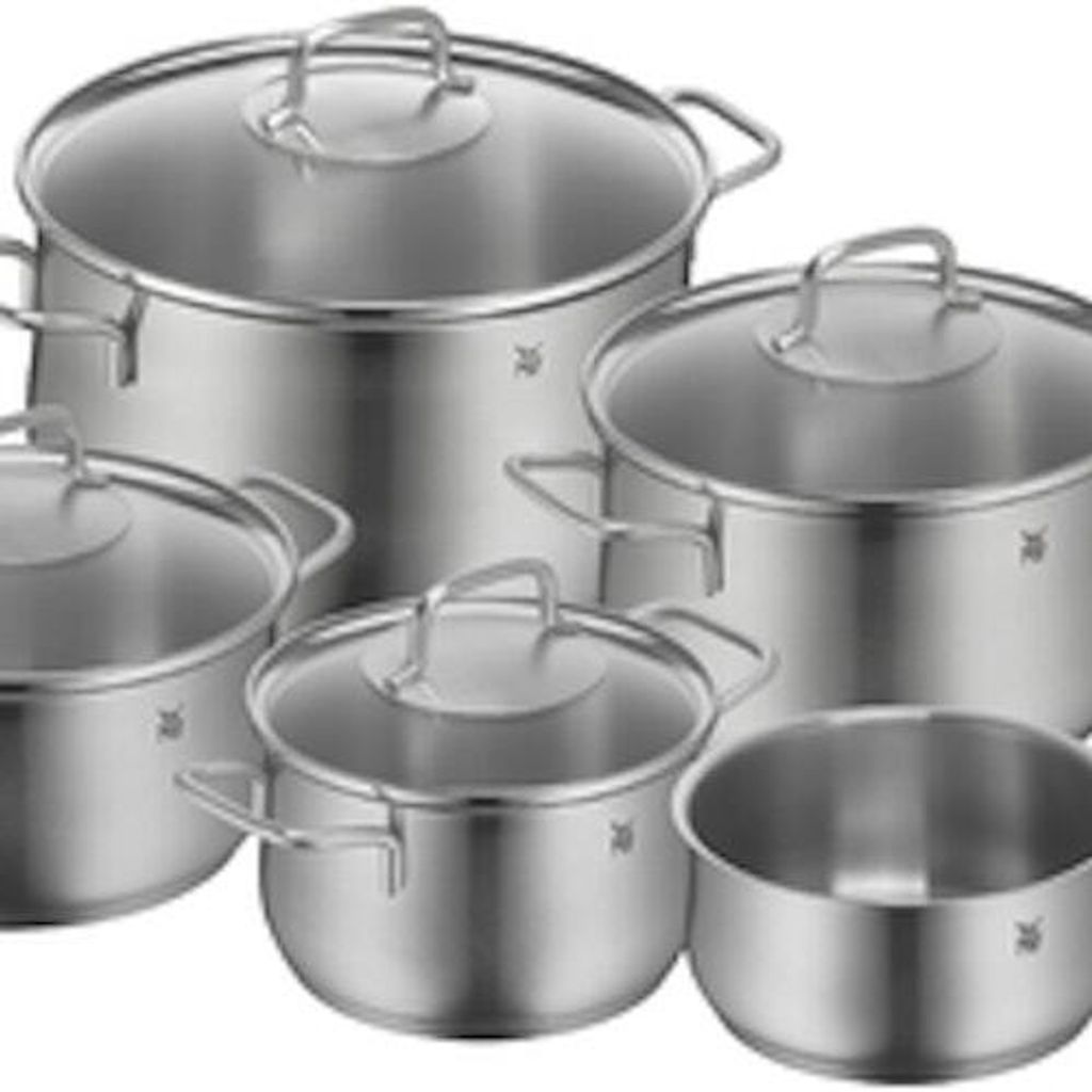 A set of stainless steel pots and pans with glass lids.