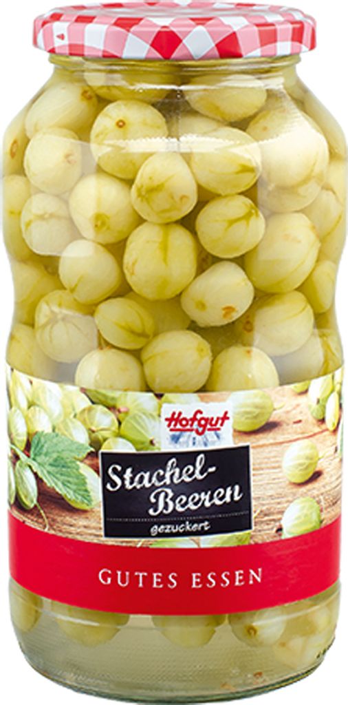 A glass jar filled with preserved gooseberries, with a label on the front.