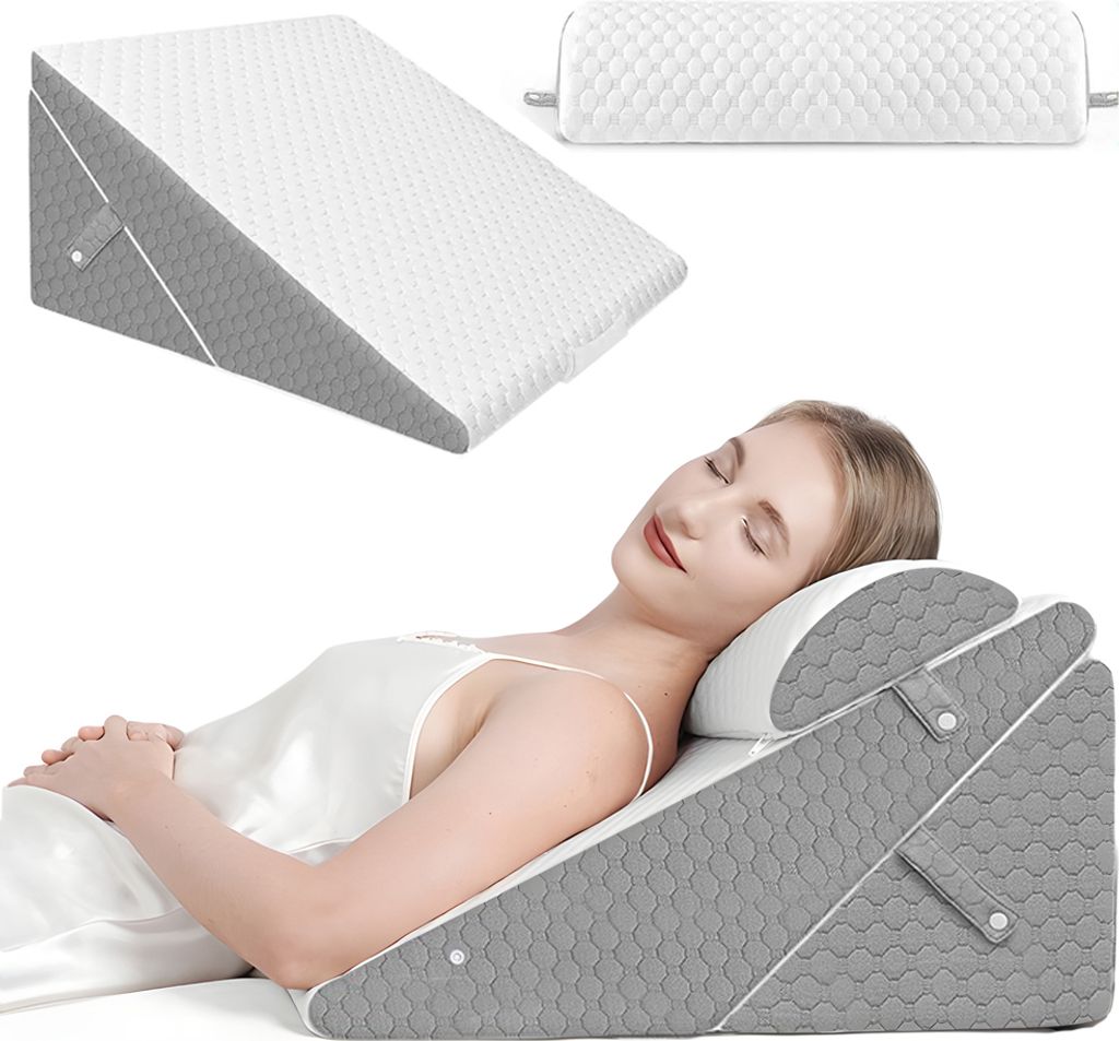 A woman is sleeping on a wedge pillow set.