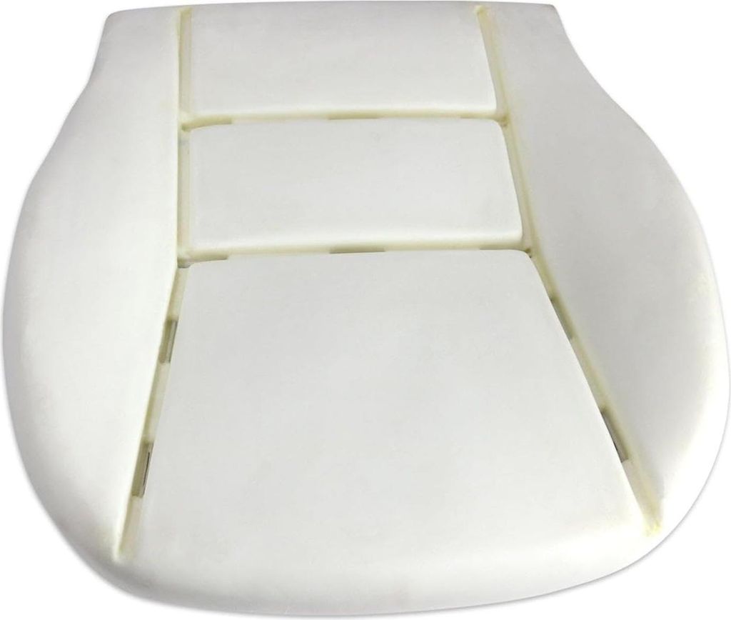 A white foam seat cushion for a vehicle.