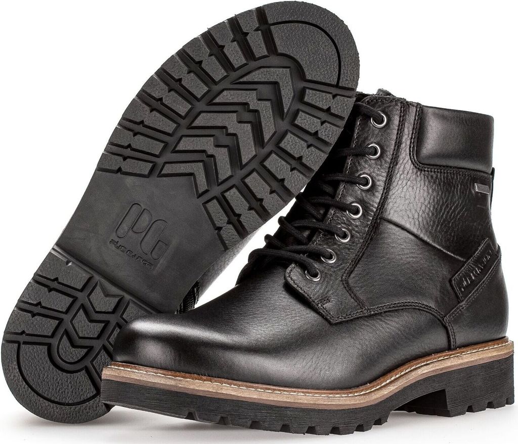 A pair of black leather lace-up boots shown from a slightly elevated angle, with one boot standing upright and the other lying on its side, revealing the sole.