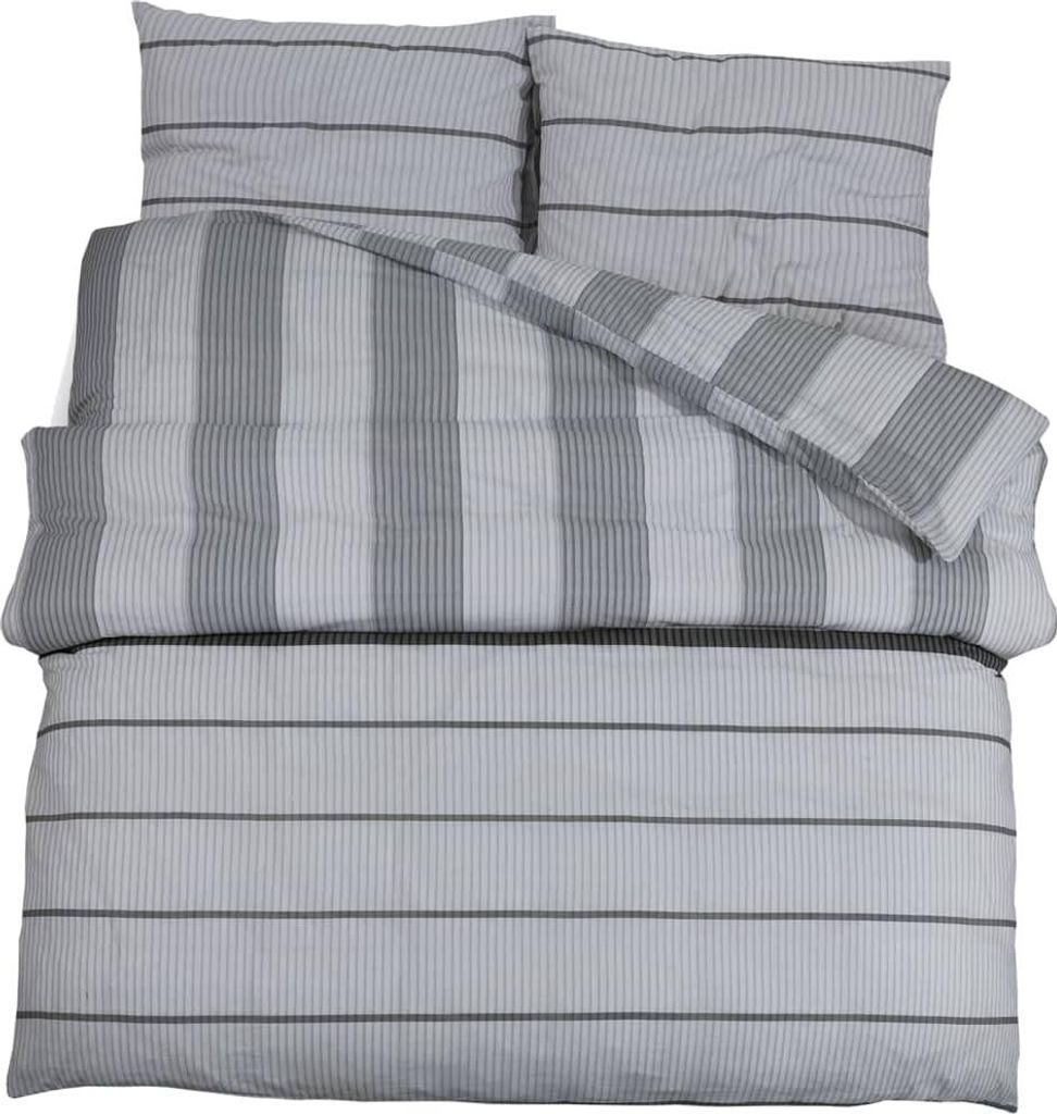 A neatly folded bedding set with two pillowcases and a duvet cover, all featuring a striped pattern.