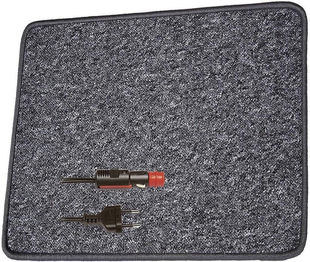 A close-up view of a car heating mat with two electrical connectors.
