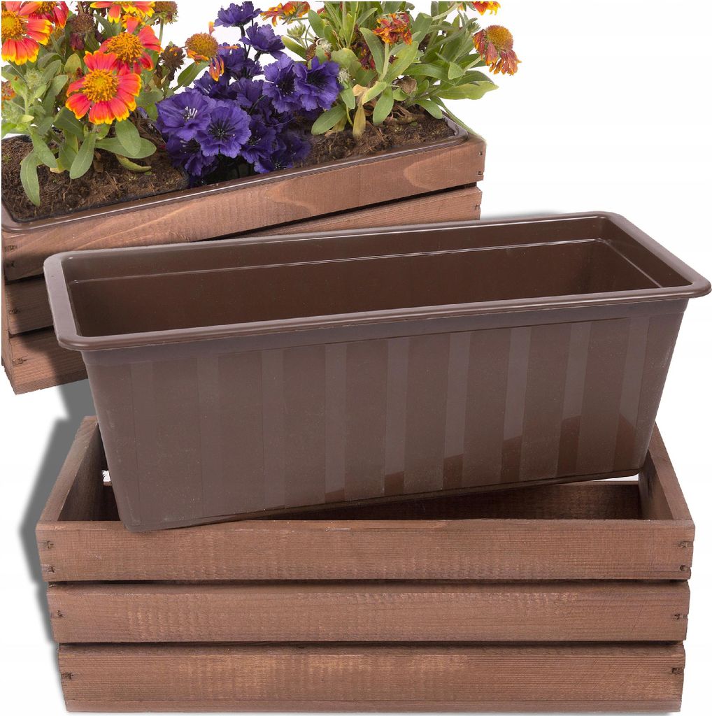 A brown plastic planter insert sits inside a brown wooden crate. Another planter with flowers is visible in the background.