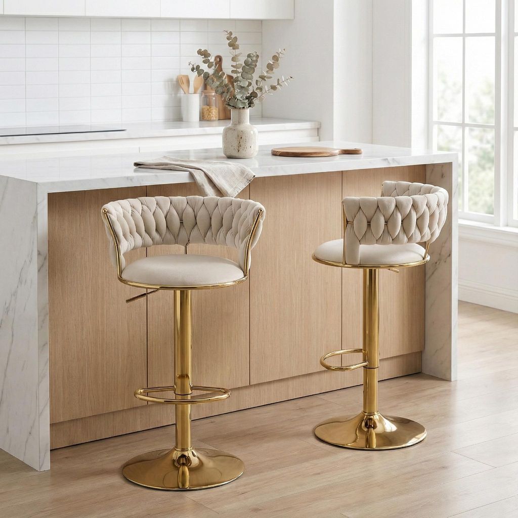 Two bar stools are placed at a kitchen island in a modern kitchen.