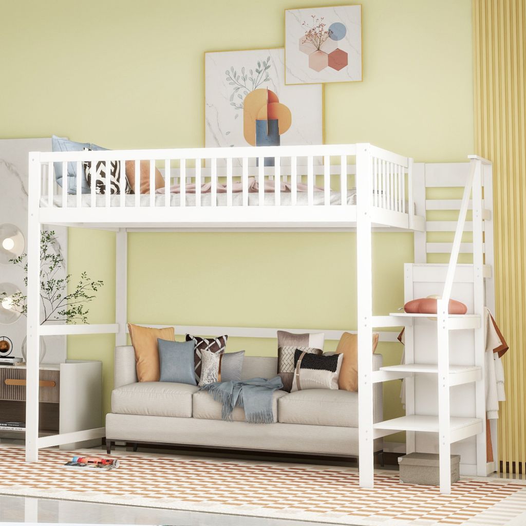 A white loft bed with a sofa underneath, set in a room with yellow walls and artwork.