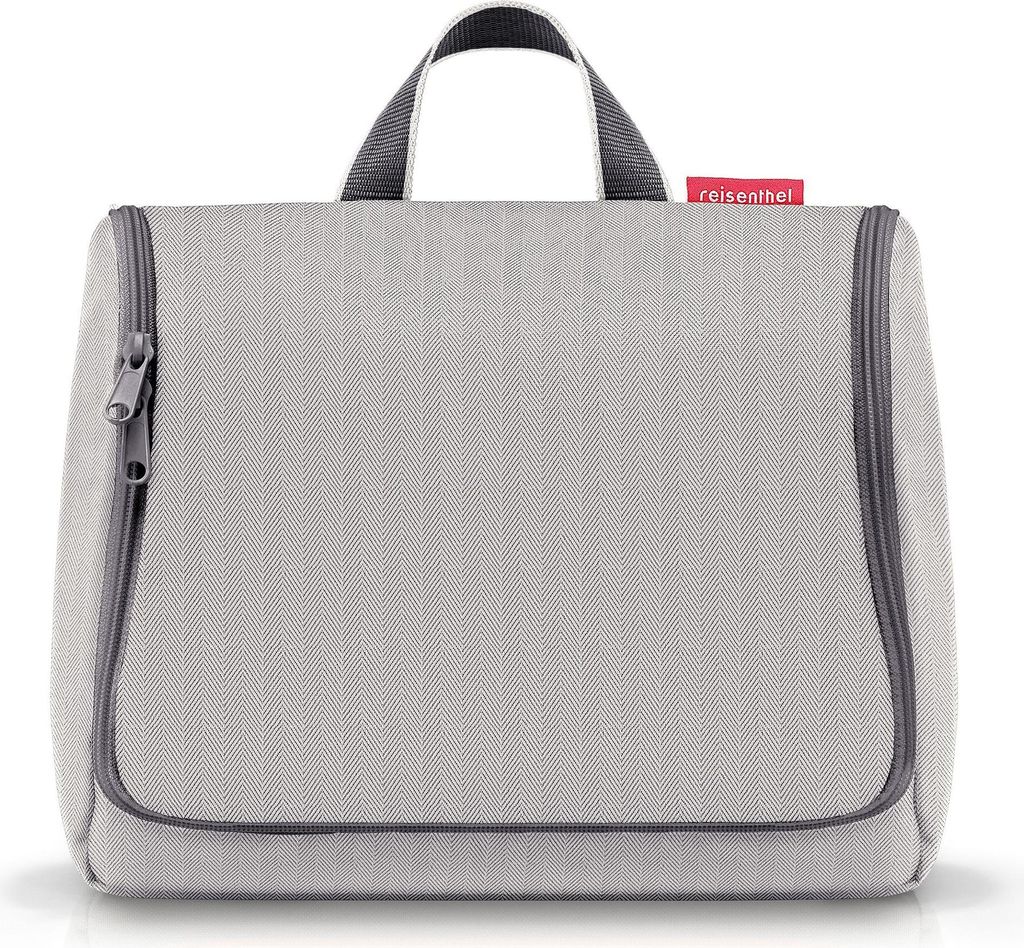 A light gray toiletry bag with a red brand tag.