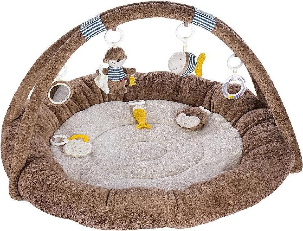 A baby activity nest with hanging toys.