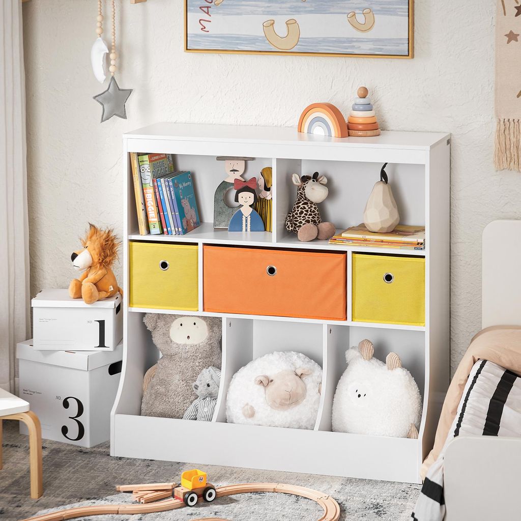 A white toy storage unit filled with stuffed animals and books, placed in a child's room.