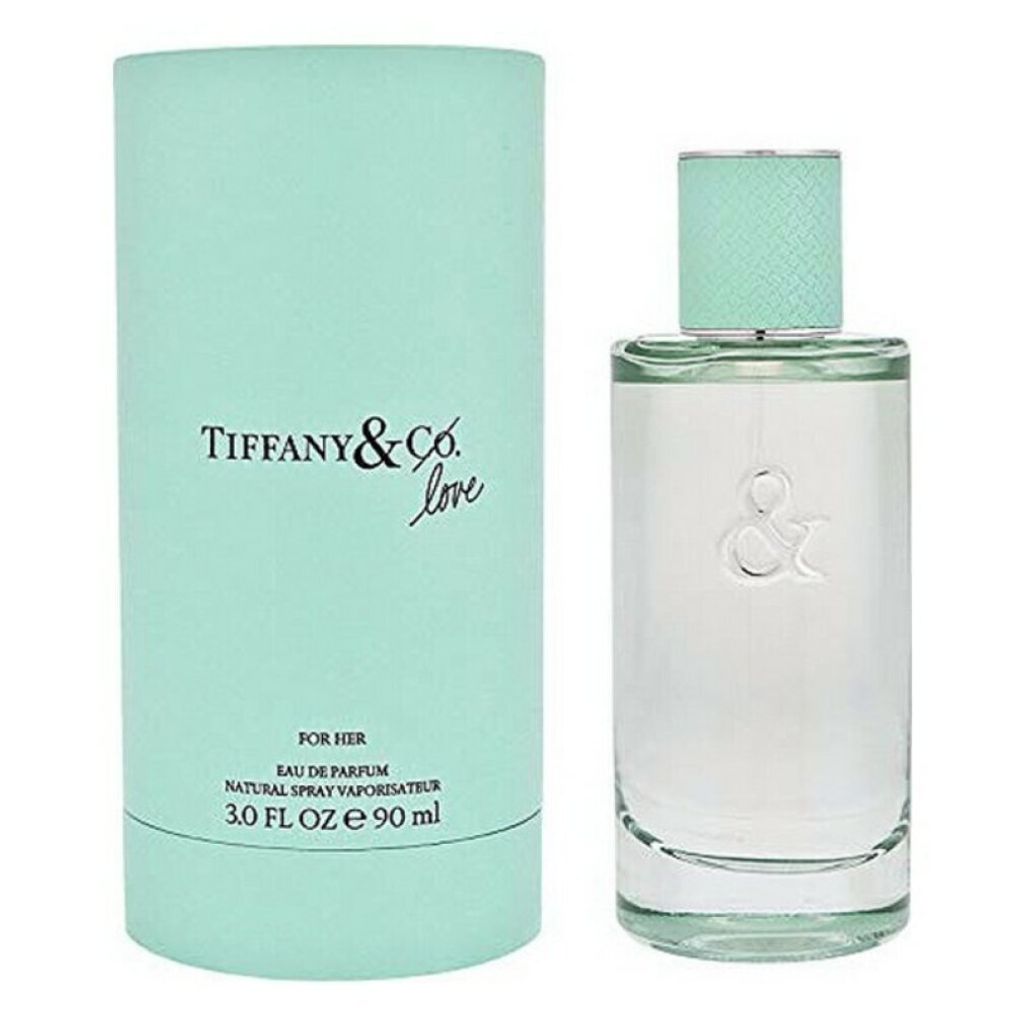 A perfume bottle and its packaging are displayed side-by-side against a white background.