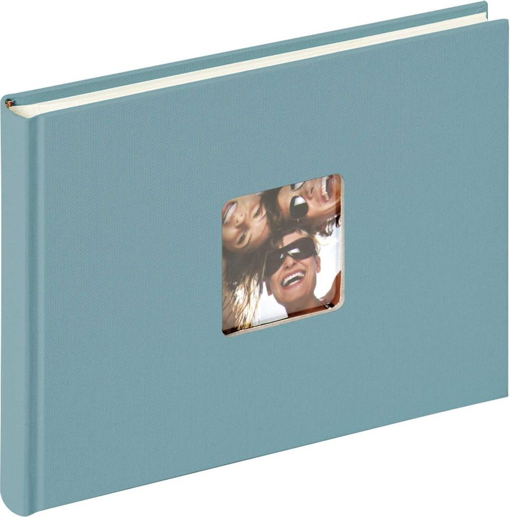 A blue photo album with a window on the cover showing a picture of three people.