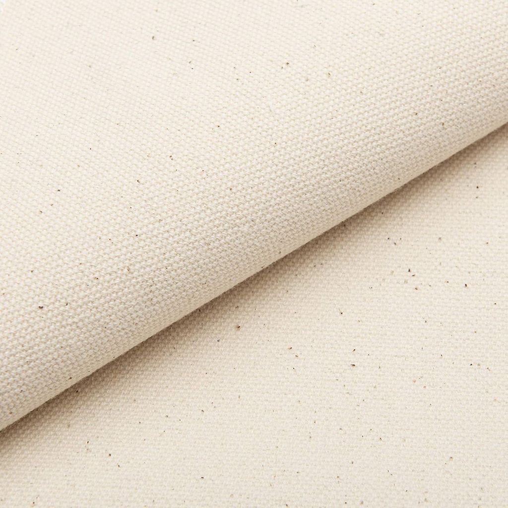A close-up, diagonal view of a piece of beige fabric, folded over itself.