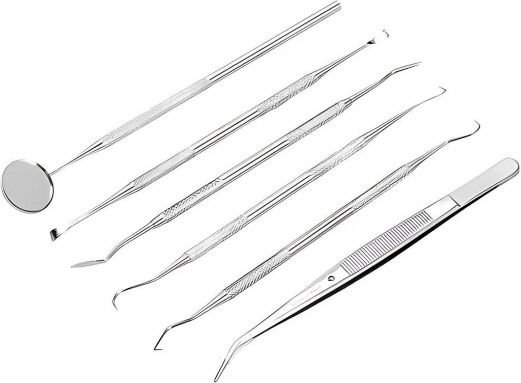 A set of dental tools arranged diagonally on a white background.
