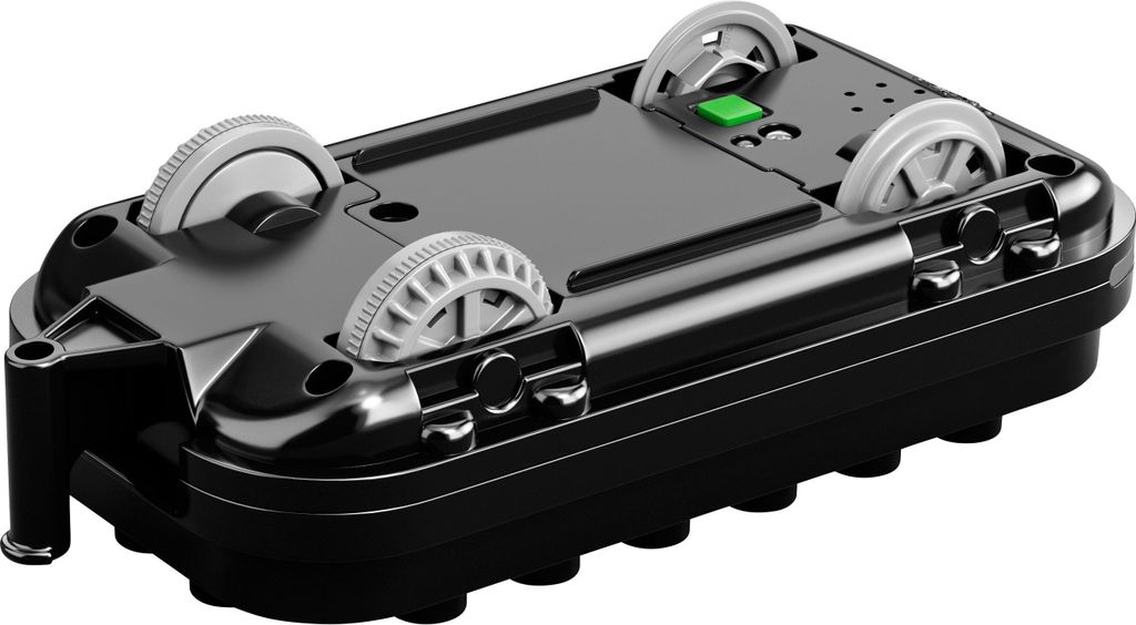 The underside of a toy train locomotive with wheels and a green button.