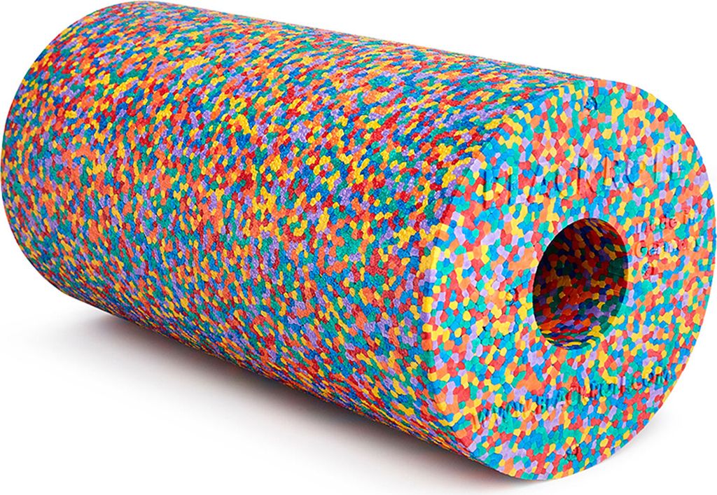 A colorful foam roller with a hole in the center, lying on a white surface.