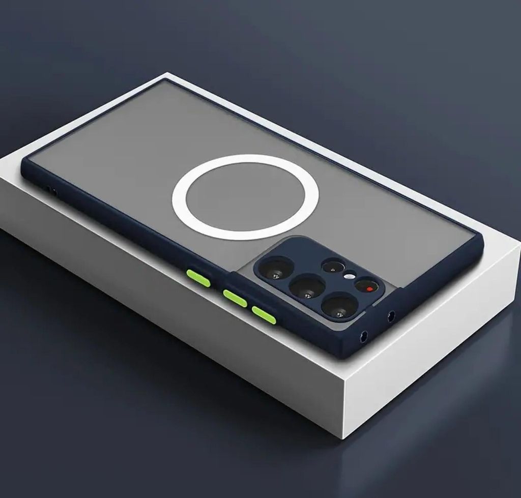 A dark blue phone case with a transparent back and a white magnetic ring is displayed on a white block against a dark gray background.