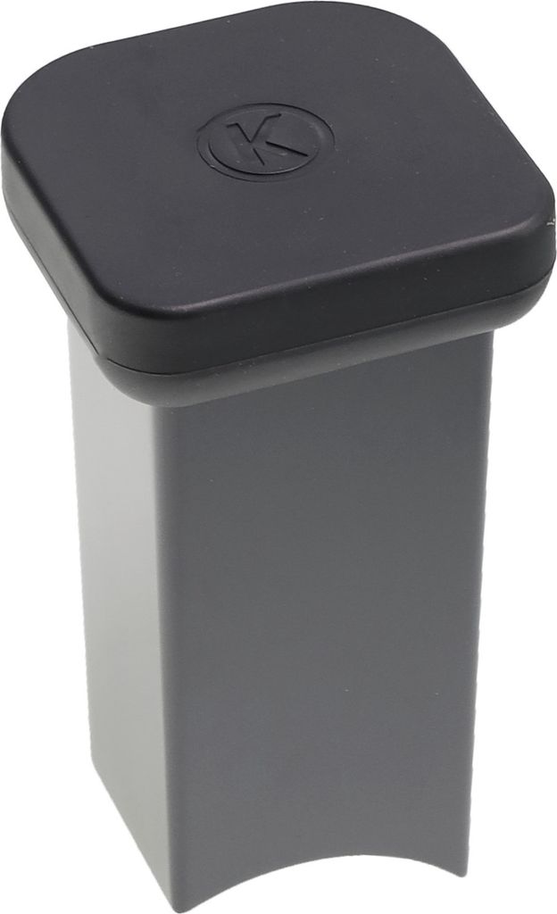 A close-up studio shot of a food processor attachment part.