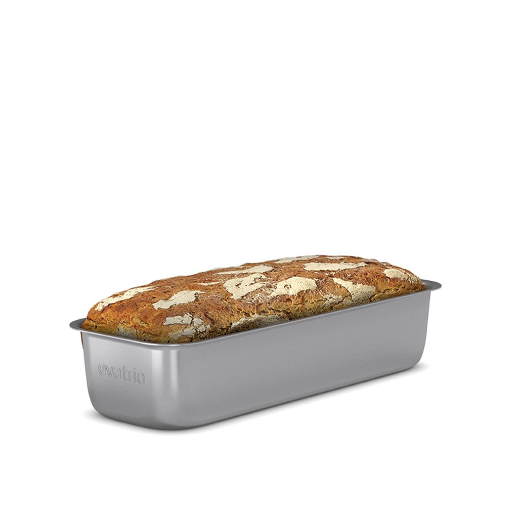 A loaf of bread in a baking pan, isolated on a white background.