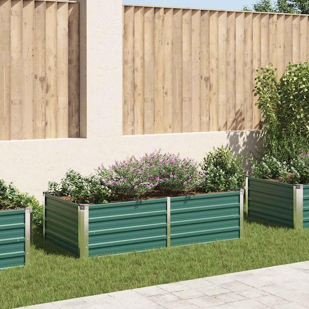 Raised garden beds filled with plants in a garden setting.