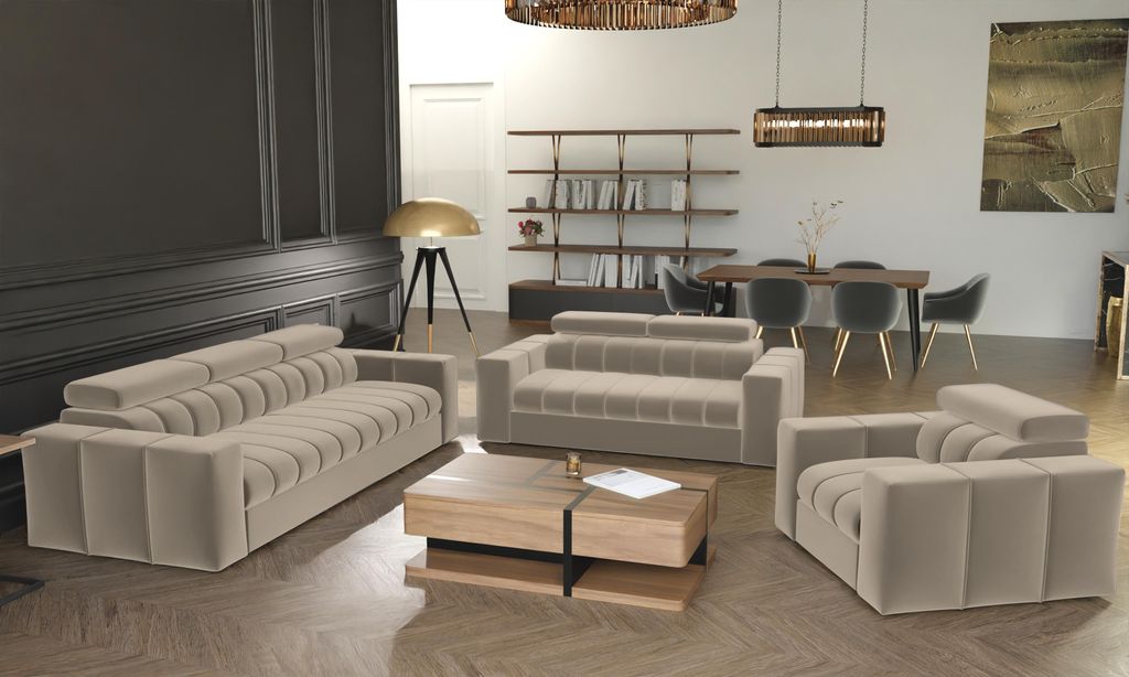 A modern living room with a beige sofa set, coffee table, and bookshelf.