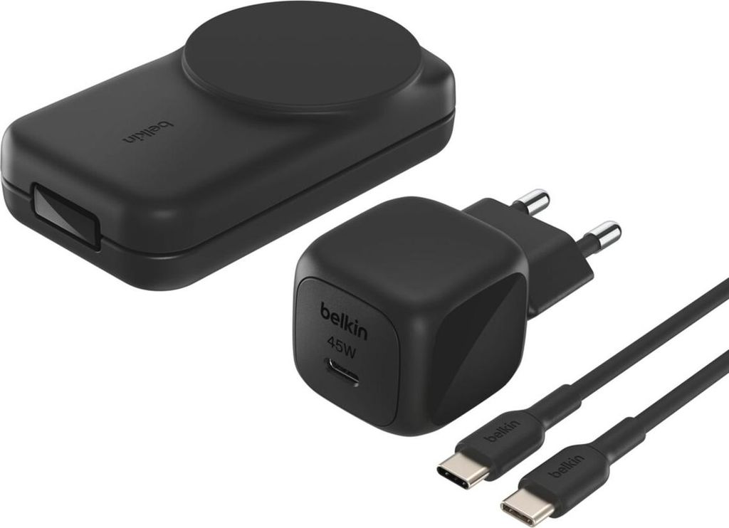 A black wireless charger, a black USB-C power adapter, and two black USB-C cables are arranged on a white background.