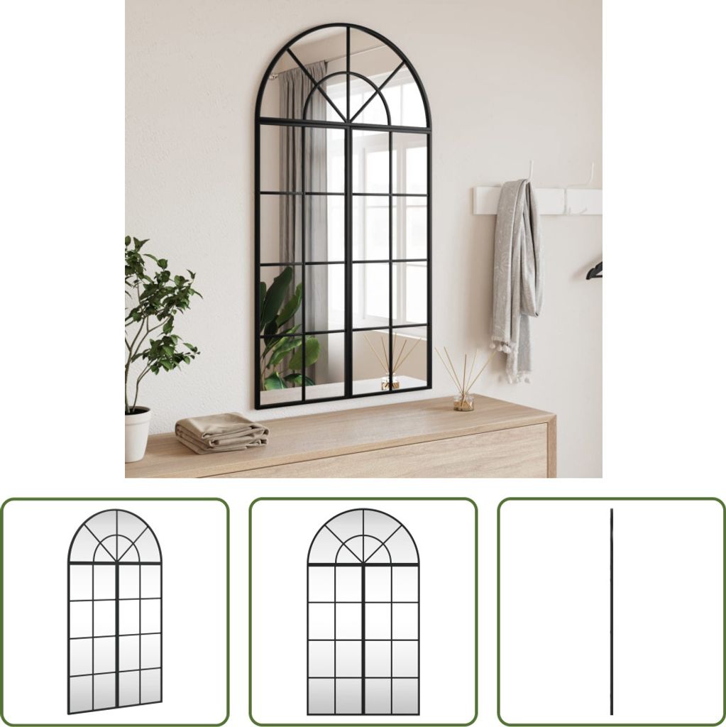 A black arched window mirror is mounted on a wall above a wooden dresser. A plant is on the left side of the dresser, and a scarf is hanging on the wall to the right of the mirror.