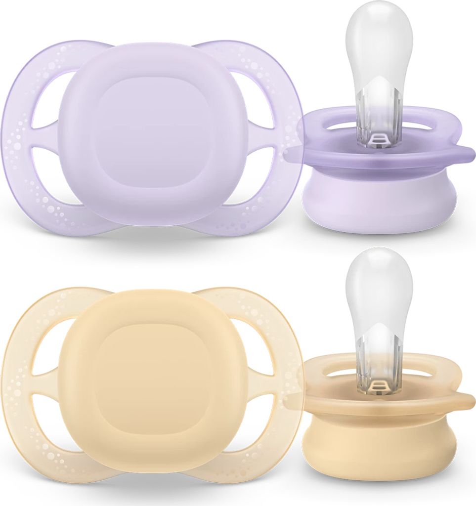Two pairs of baby pacifiers, one purple and one beige, displayed against a white background.