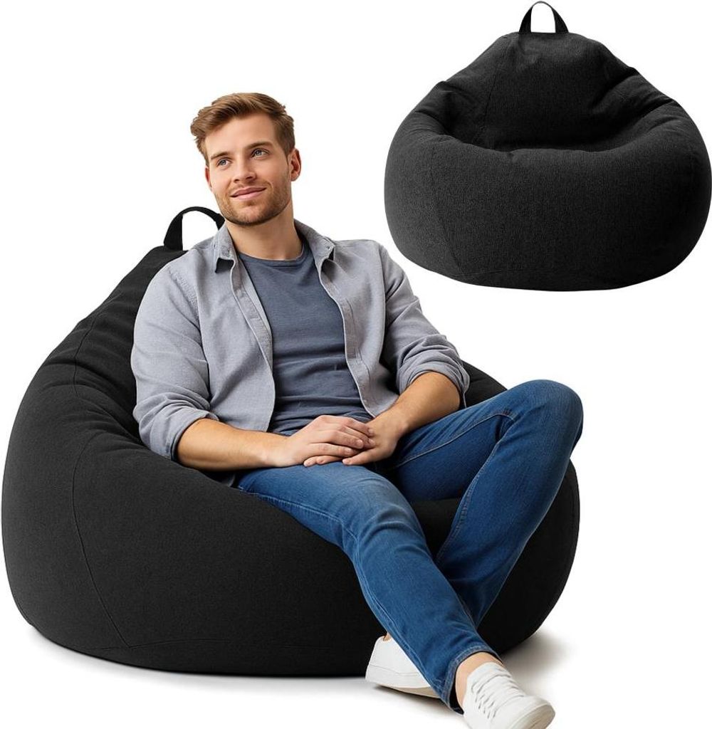 A man is sitting on a black beanbag chair, with another black beanbag chair shown in the background.