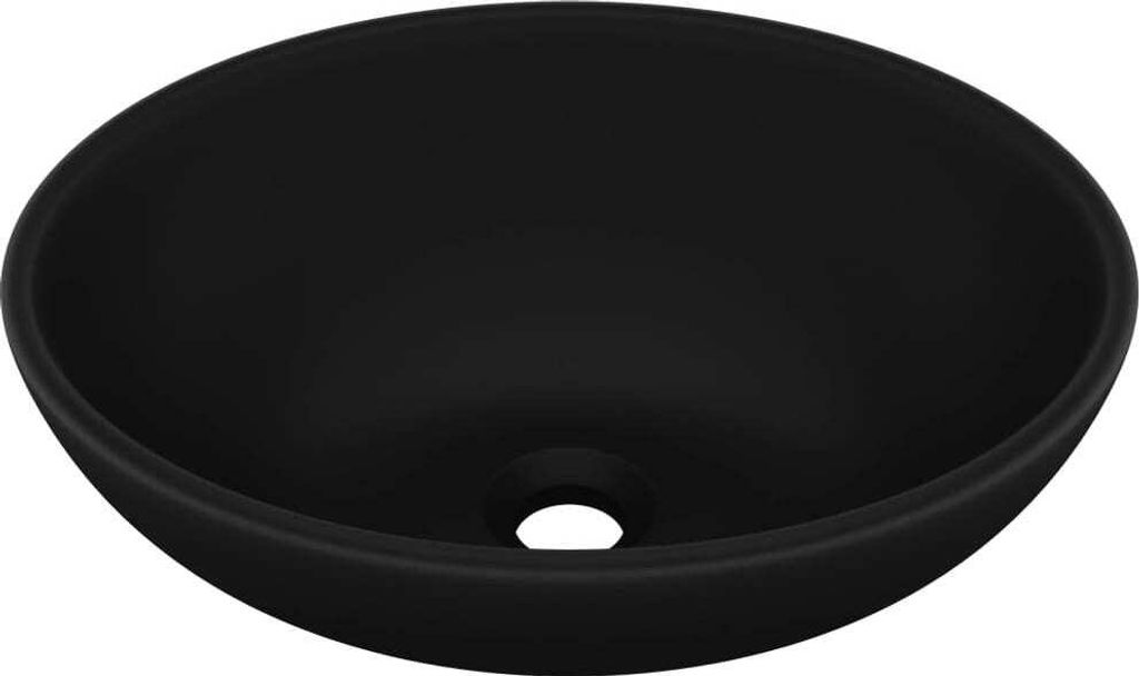 A black oval ceramic sink with a drain hole in the center.