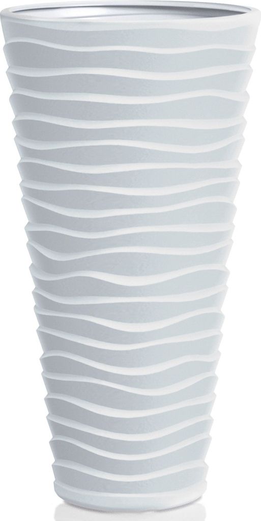 A white planter with a wavy pattern.