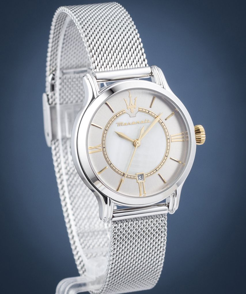 A close-up studio shot of a women's watch against a blue background.