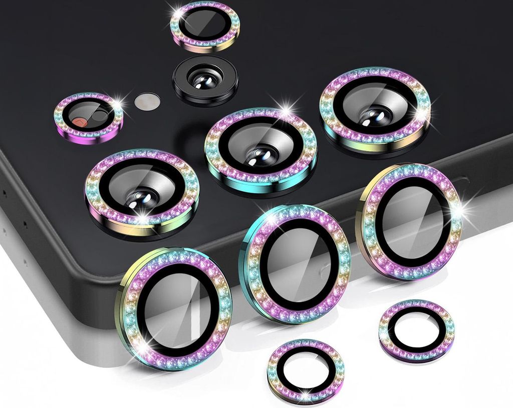 A collection of camera lens protectors with colorful, gem-like borders, arranged on a dark surface and a white surface.