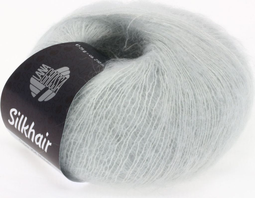 A ball of light gray, fluffy yarn with a black label.